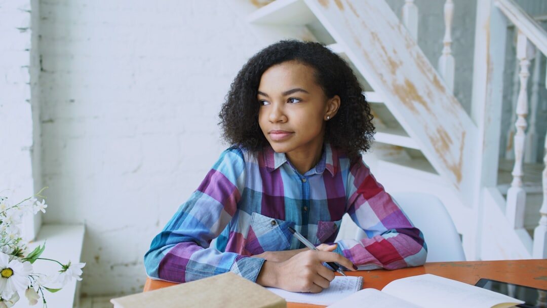 african woman entrepreneur thinking