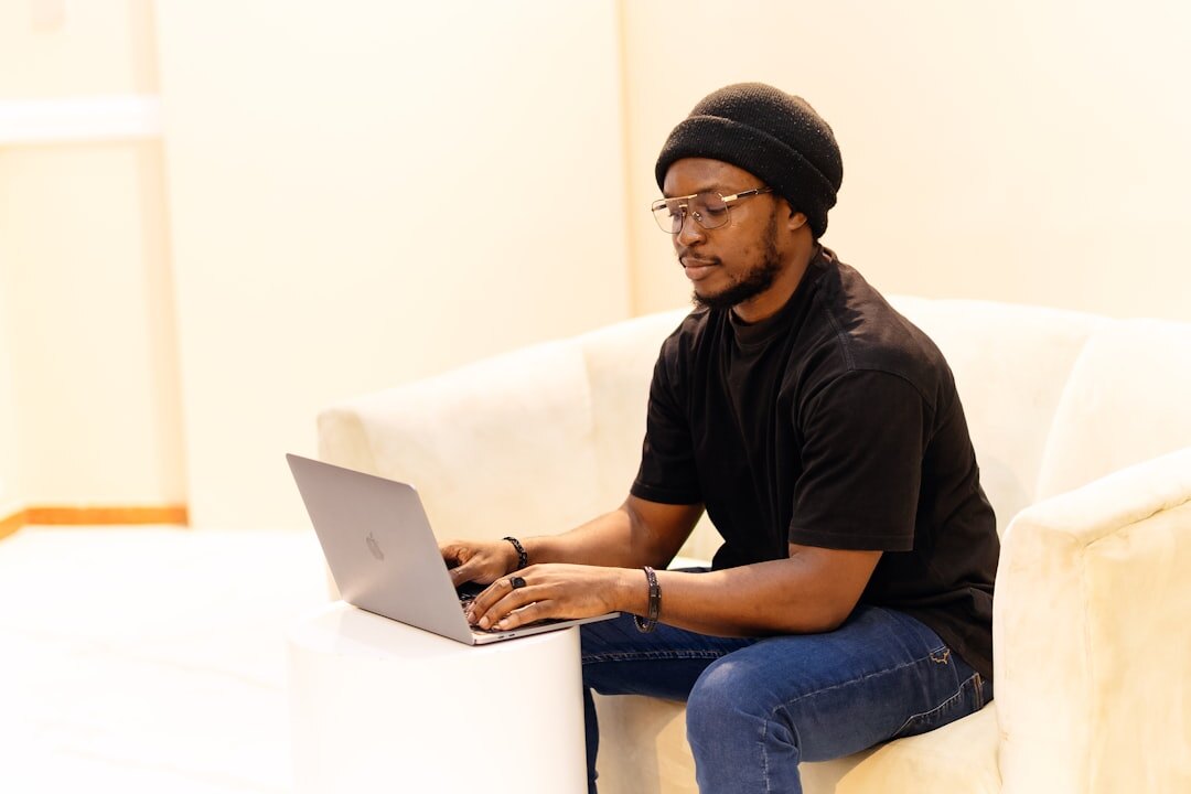 young african entrepreneur working on laptop